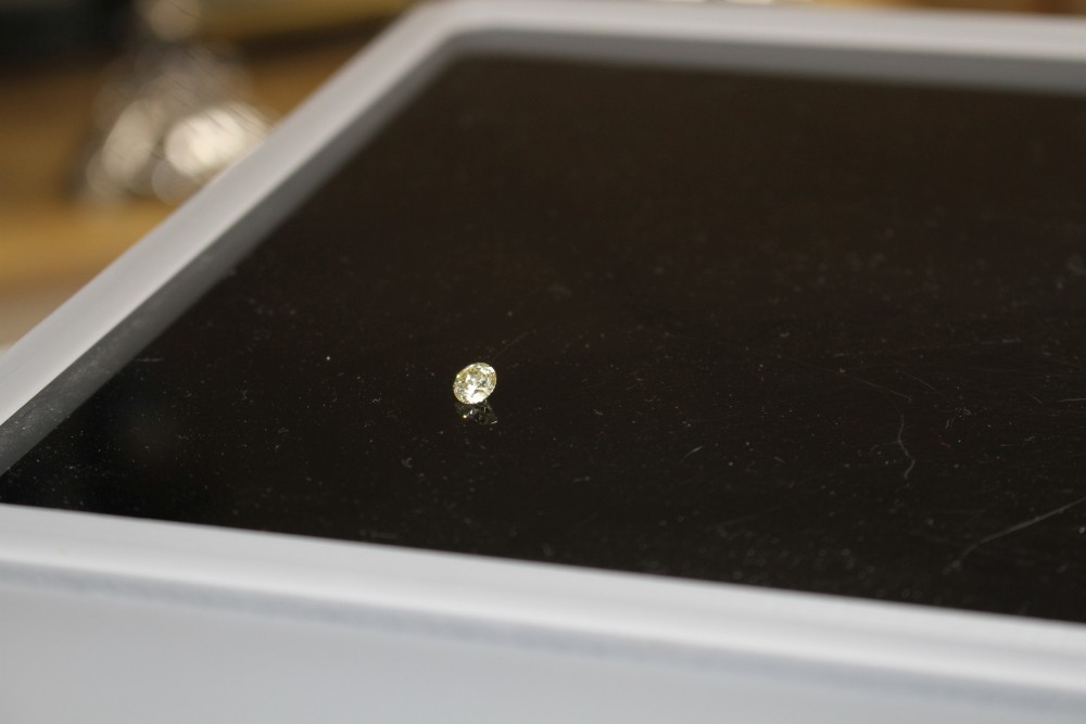 An unmounted round brilliant cut diamond, weighing 1.02ct, with an estimated colour and clarity of S/T/U? and I3.